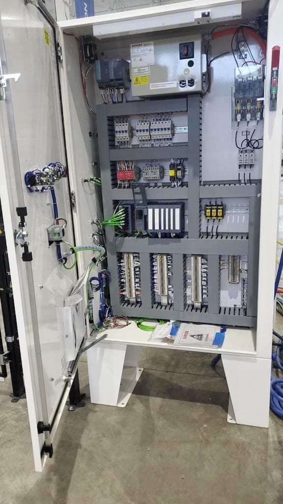 PLC programming and control panel integration.